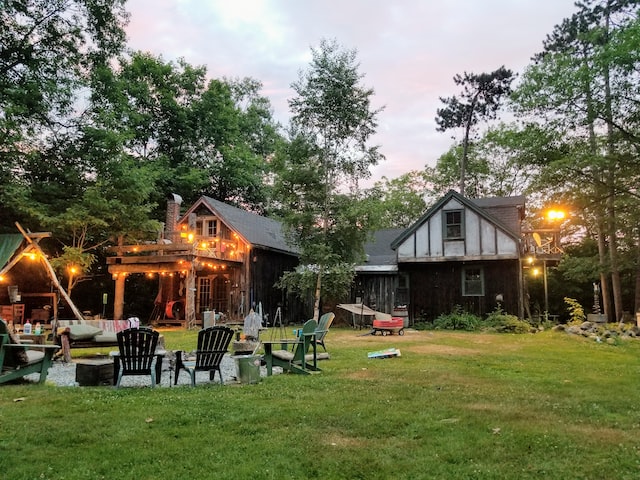 A backyard with a lot of outdoor furniture.