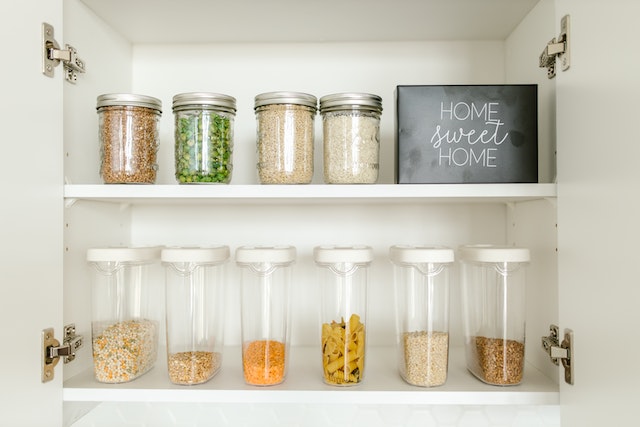 organized jars in a cupboard