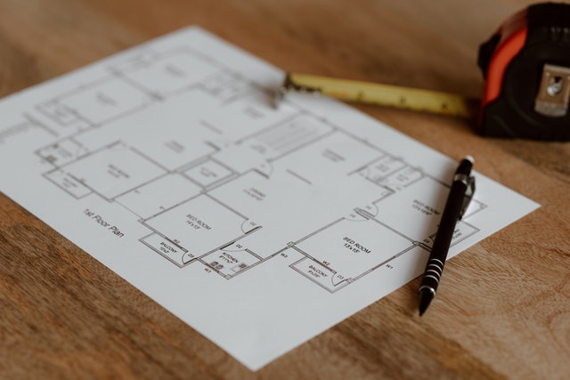 an architecture plan on a wooden table