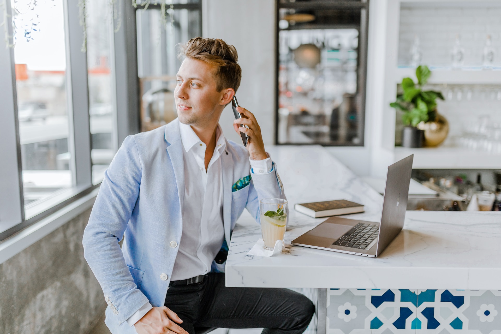 A realtor talking to a client over the phone