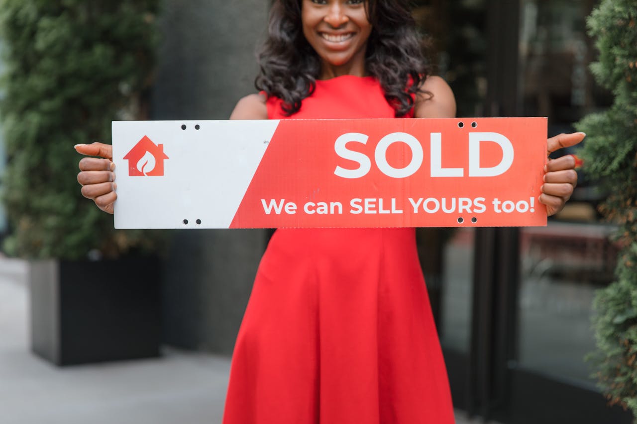 A woman holding a signage.