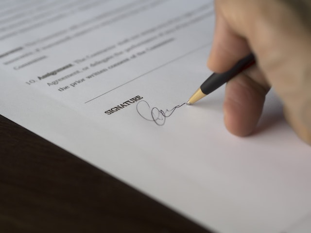 A person signing a document