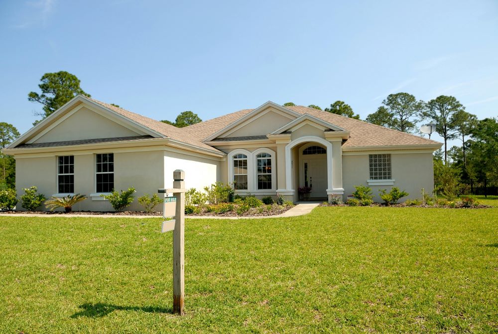 A white house with a yard