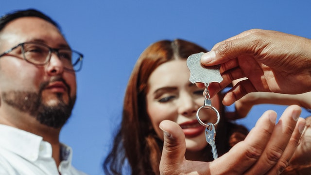 A couple getting the keys of their first home