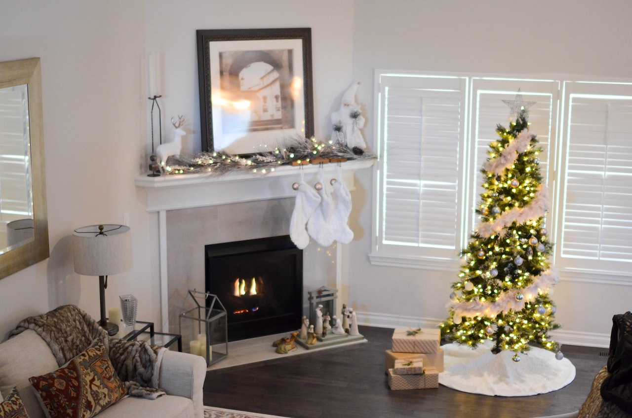 A living room with a Christmas tree and other holiday decorations